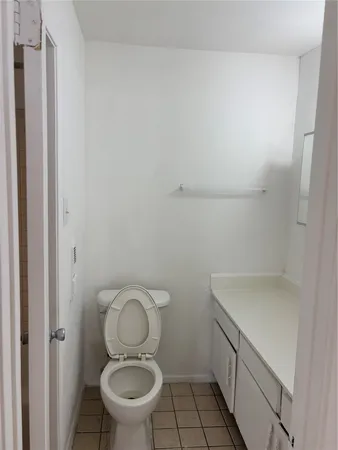 a bathroom with a toilet and a sink