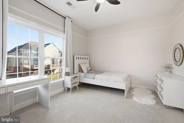 a bedroom with furniture and windows