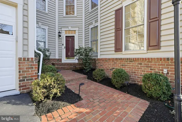 a view of a pathway both side of house