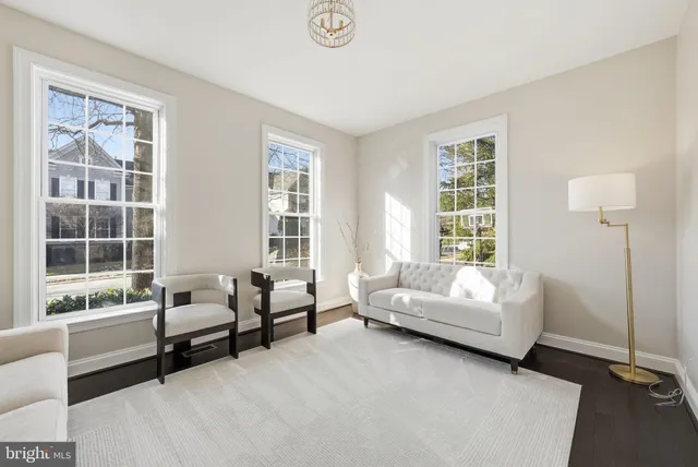 a living room with furniture and windows
