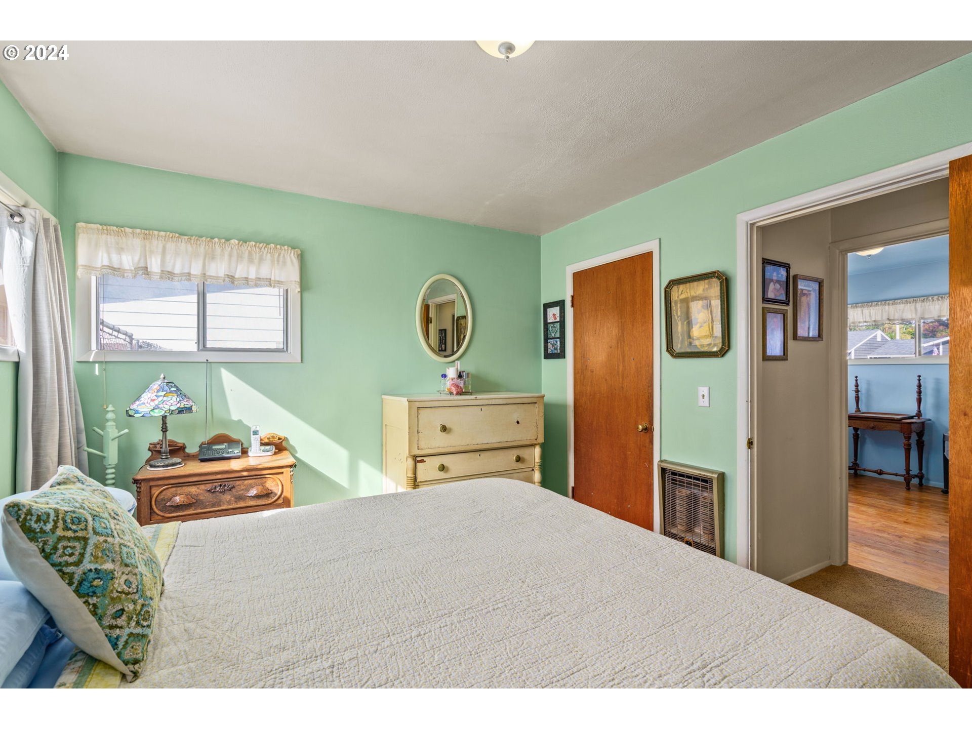 2290 18th Street Florence, OR 97439 - Photo 15 of 32 a bedroom with furniture and window