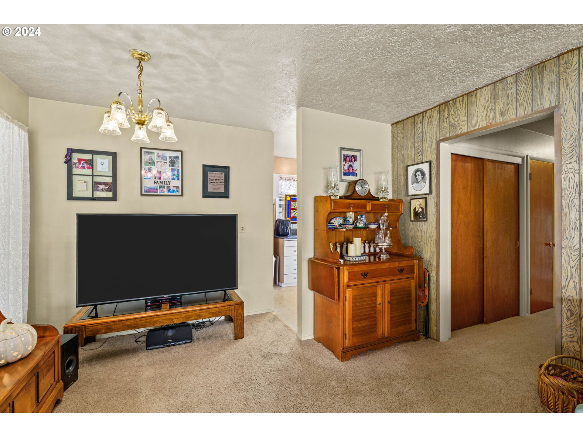 2290 18th Street Florence, OR 97439 - Photo 18 of 32 a living room with stainless steel appliances furniture and a flat screen tv