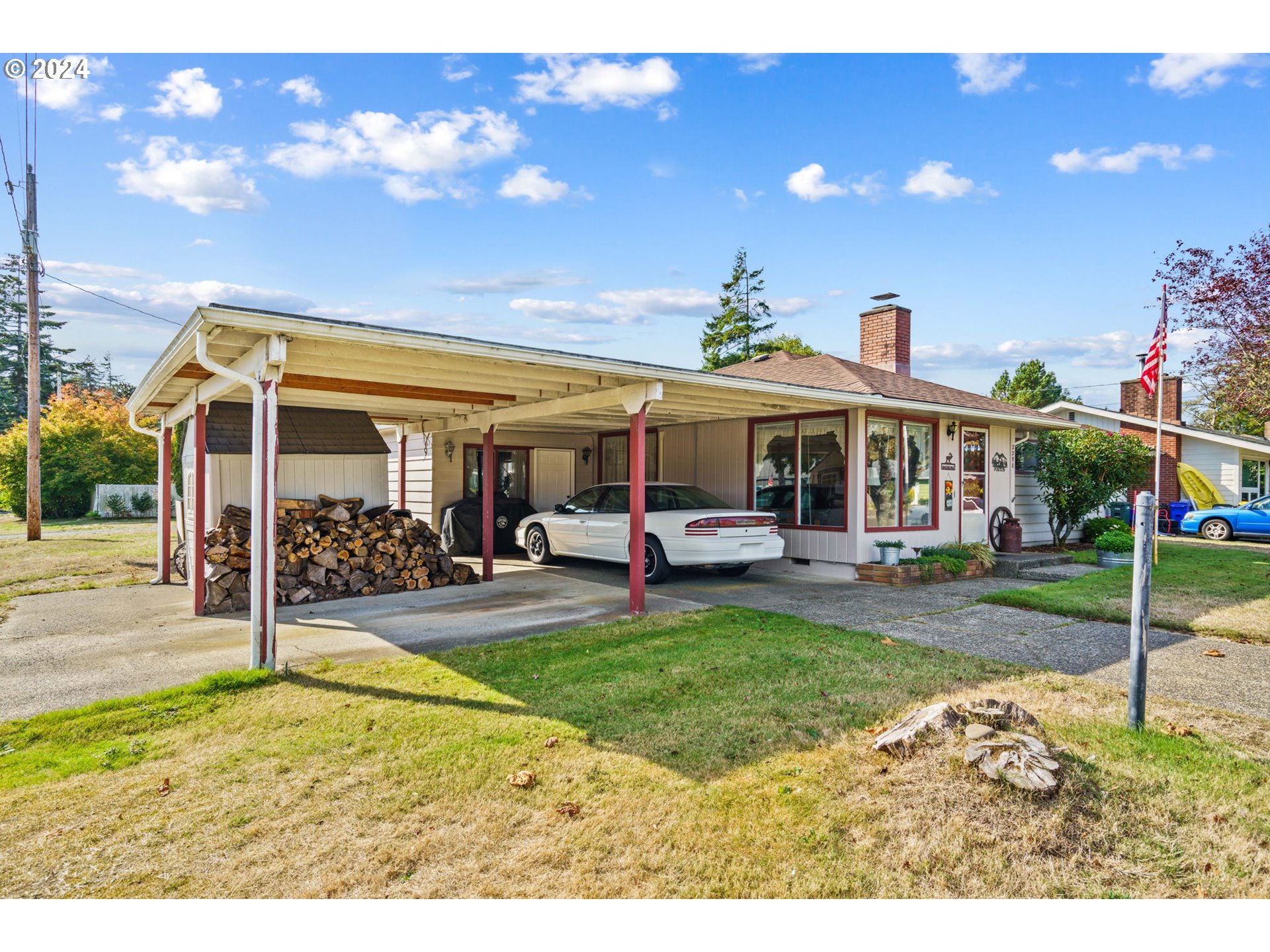 2290 18th Street Florence, OR 97439 - Photo 2 of 32 a view of a house with backyard porch and sitting area