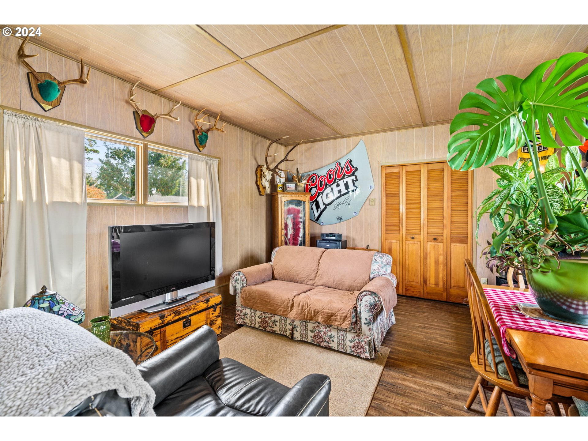 2290 18th Street Florence, OR 97439 - Photo 24 of 32 a living room with furniture and a flat screen tv