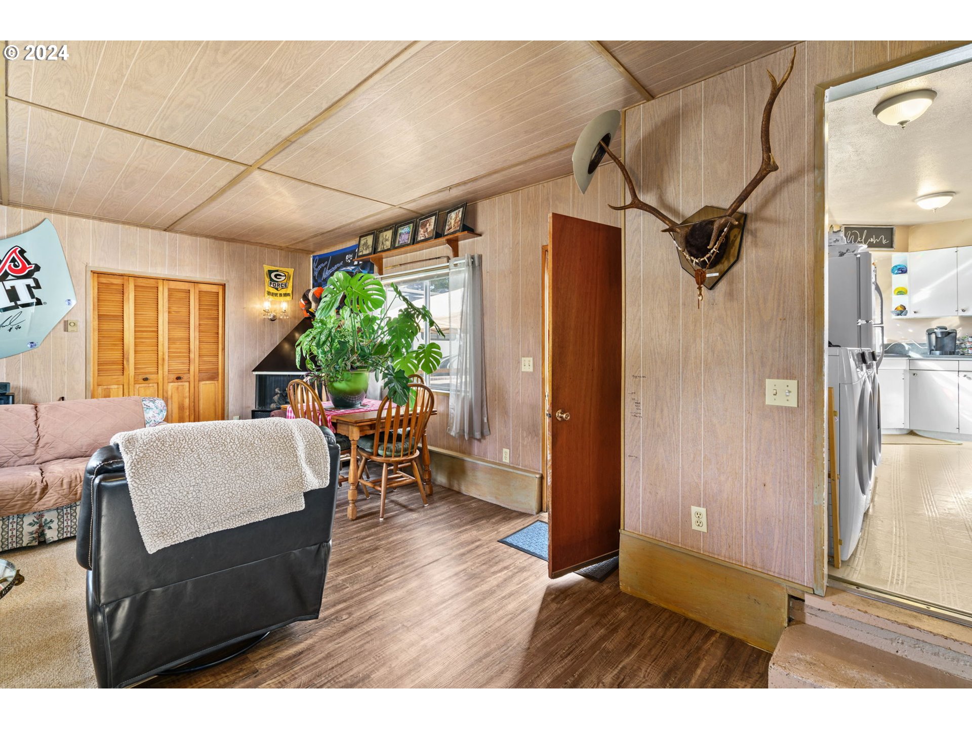 2290 18th Street Florence, OR 97439 - Photo 25 of 32 a living room with furniture a large window and wooden floor