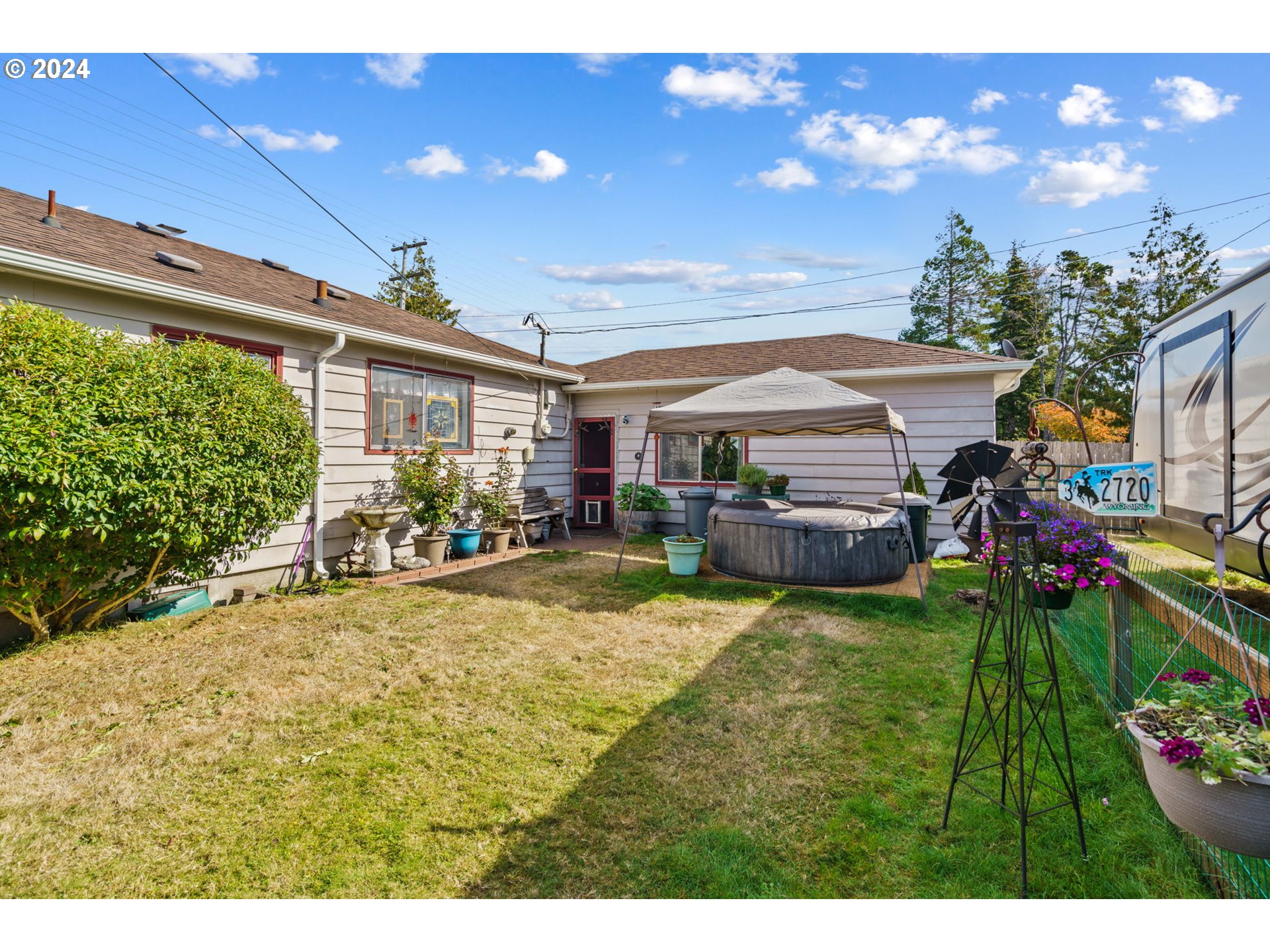 2290 18th Street Florence, OR 97439 - Photo 29 of 32 a view of a house with swimming pool and garden