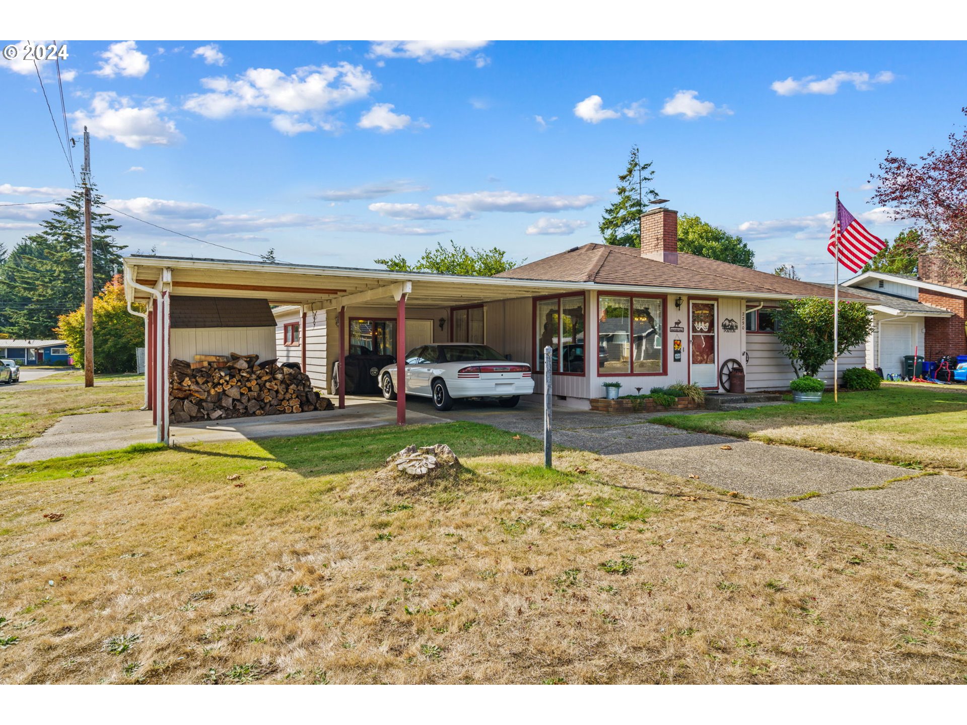 2290 18th Street Florence, OR 97439 - Photo 3 of 32 a view of a house with swimming pool and a yard