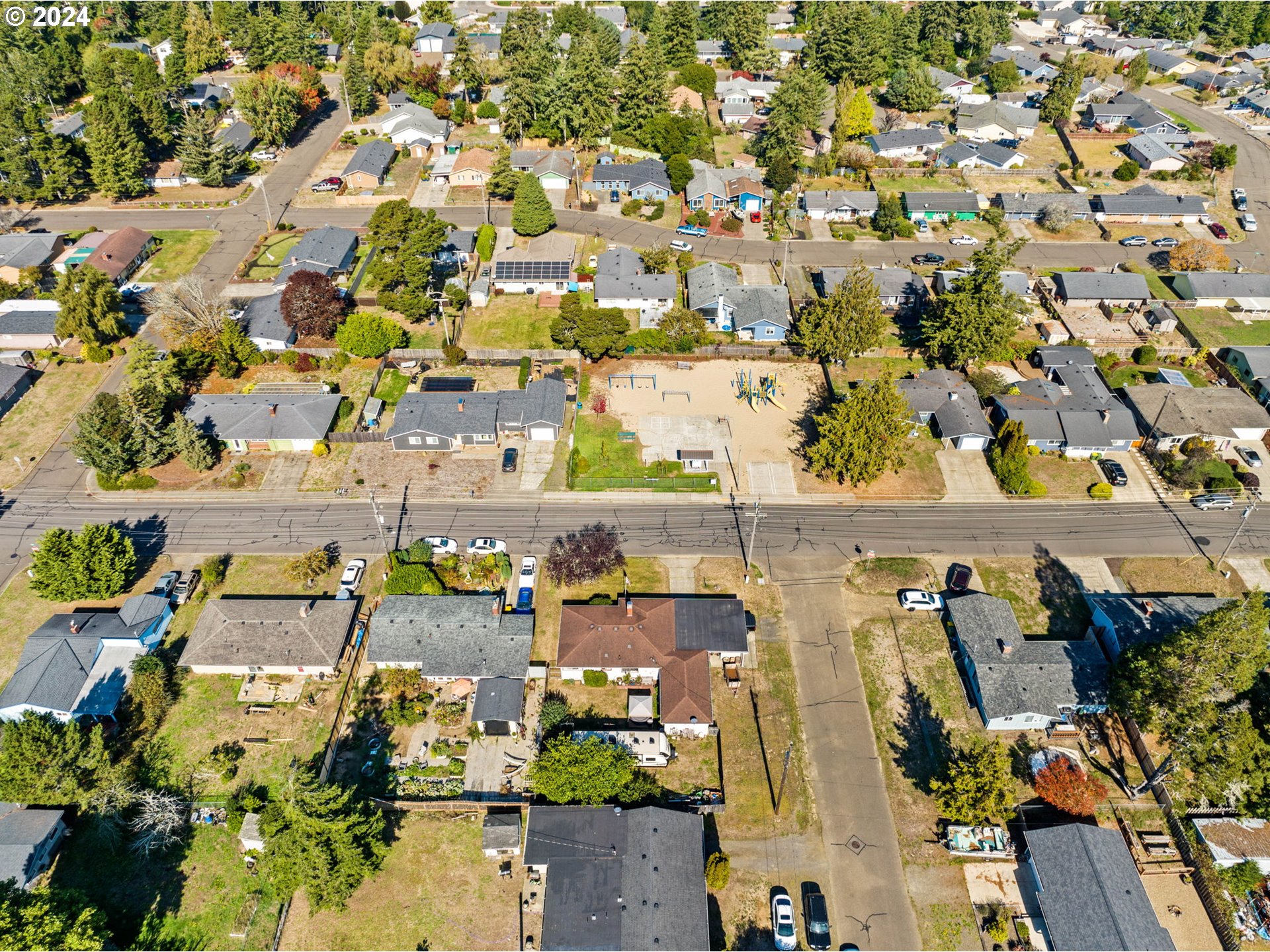 2290 18th Street Florence, OR 97439 - Photo 31 of 32 an aerial view of residential building and parking space