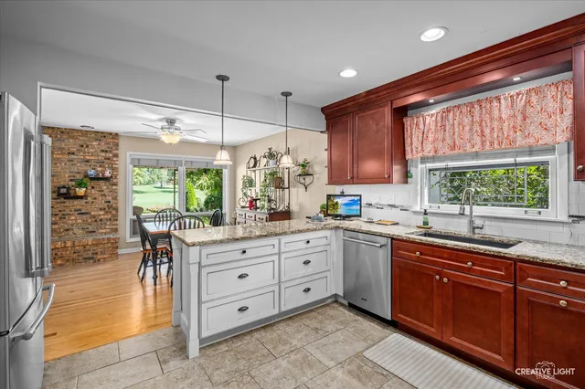 a kitchen with lots of counter top space and wooden floor