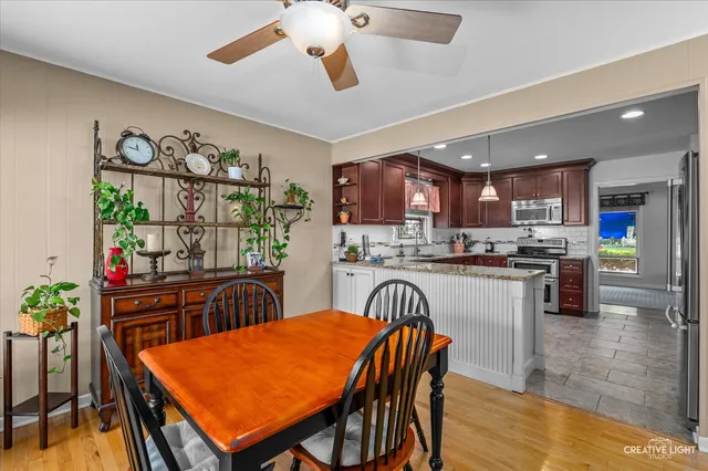a dining table and chairs in a kitchen