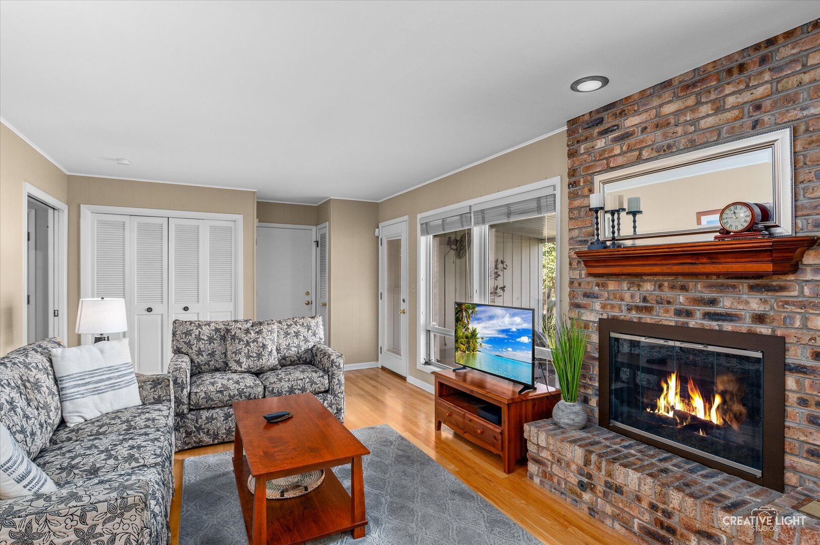 713 Burning Tree Lane Naperville, IL 60563 - Photo 16 of 35 a living room with furniture and a fireplace