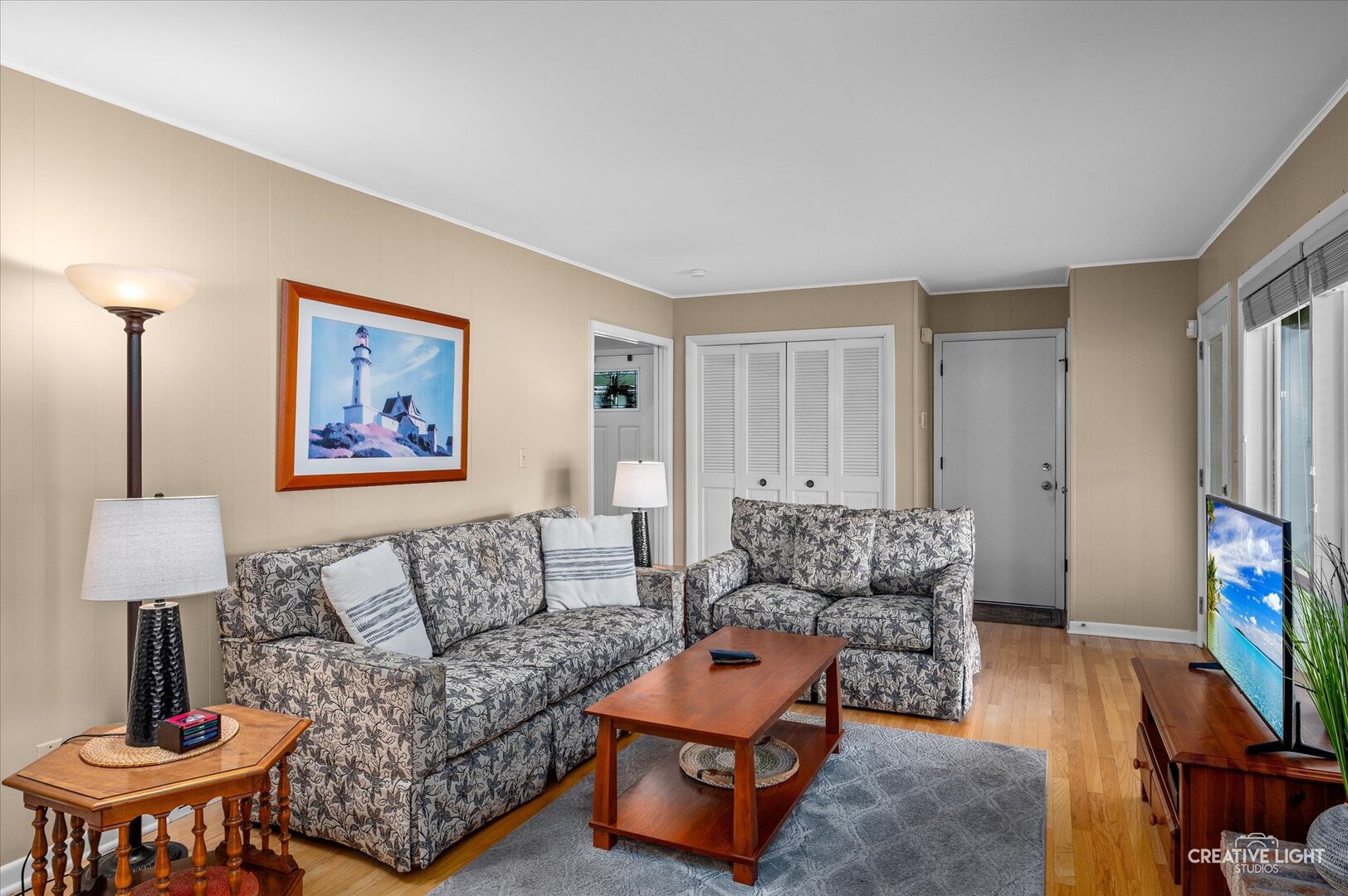 713 Burning Tree Lane Naperville, IL 60563 - Photo 17 of 35 a living room with furniture and a flat screen tv