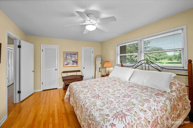 a bedroom with a large bed and a large window