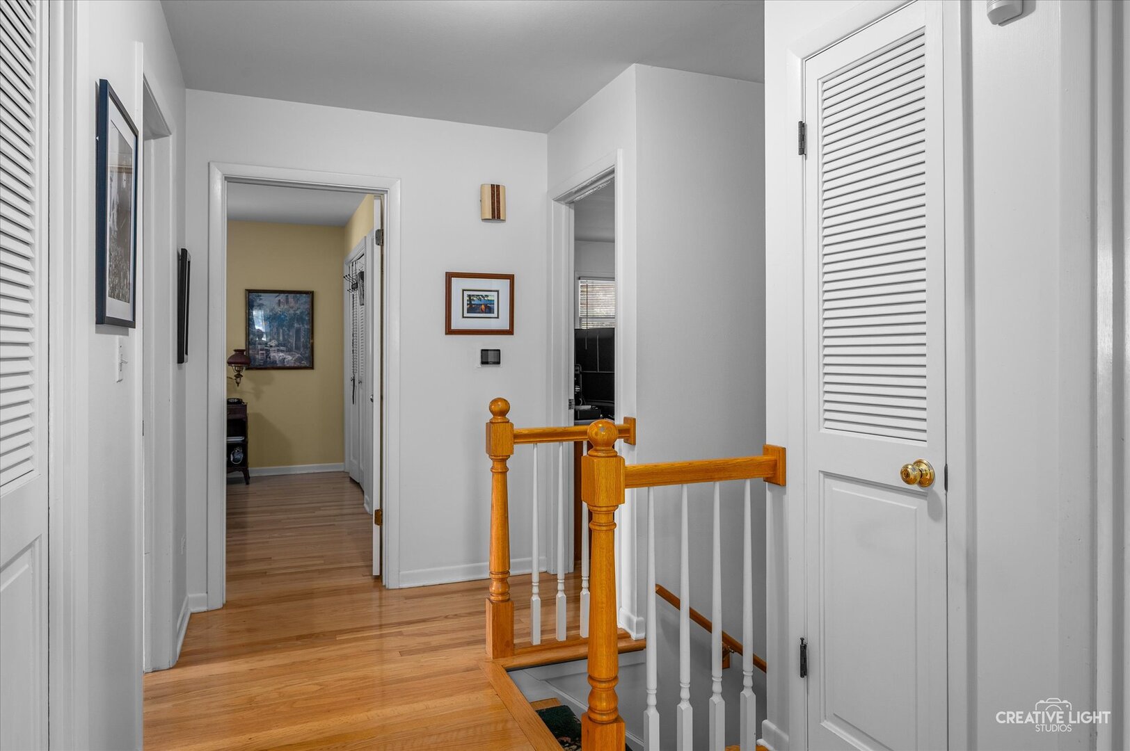 713 Burning Tree Lane Naperville, IL 60563 - Photo 24 of 35 a view of a hallway with wooden floor and staircase
