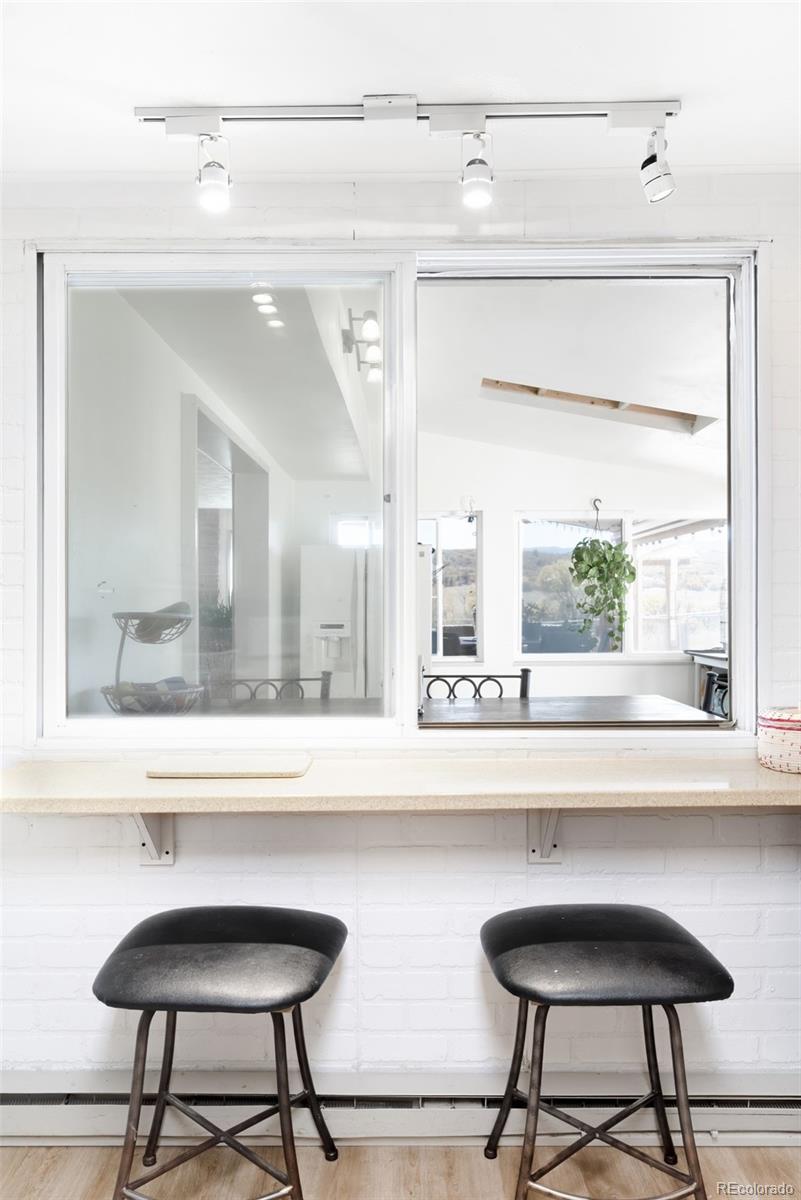 5354 Jackson Creek Road Sedalia, CO 80135 - Photo 14 of 47 a bathroom with a mirror a sink and a window