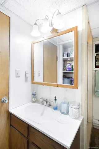 a bathroom with a sink and a mirror