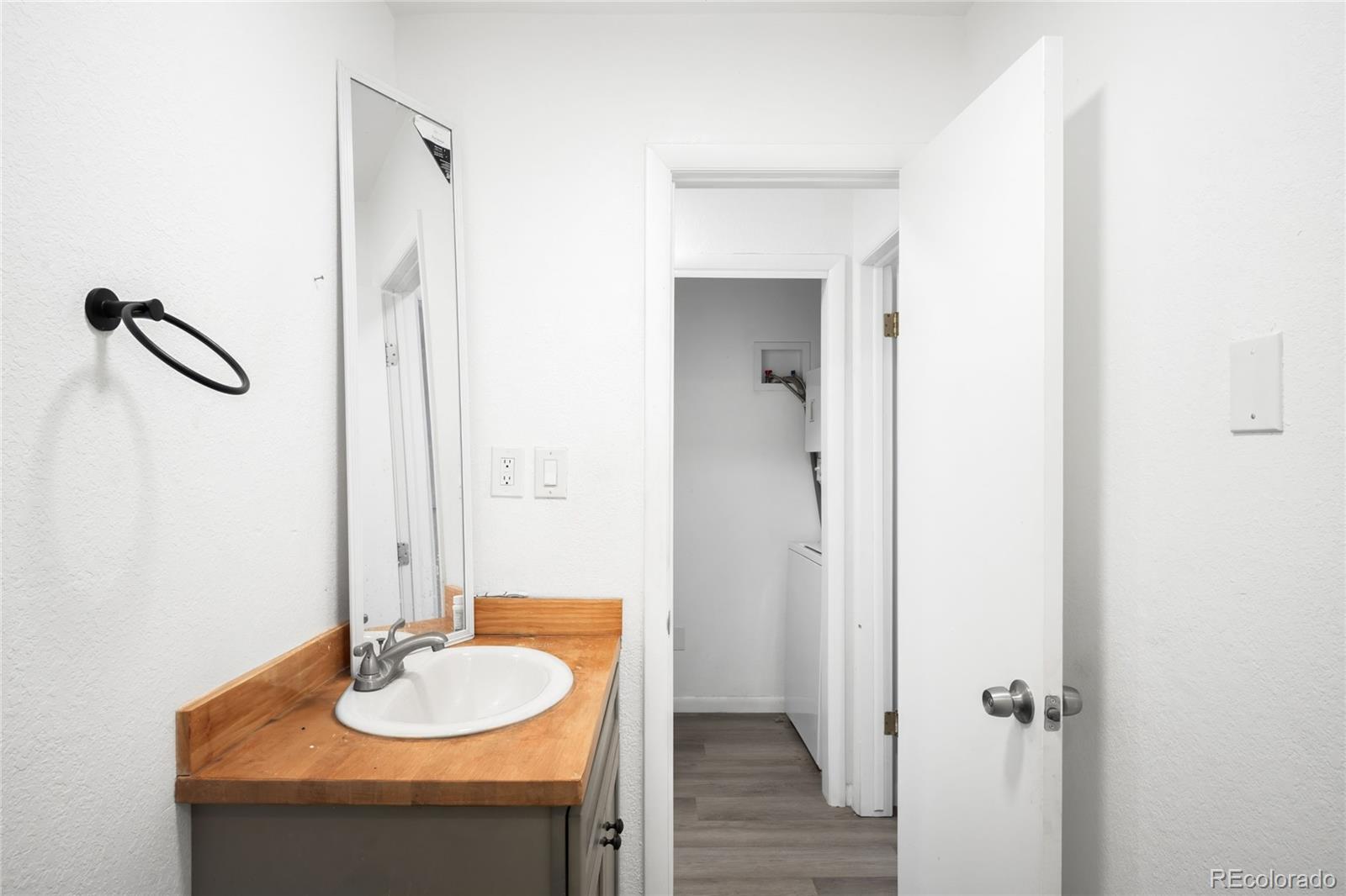 5354 Jackson Creek Road Sedalia, CO 80135 - Photo 26 of 47 a bathroom with a sink and a mirror