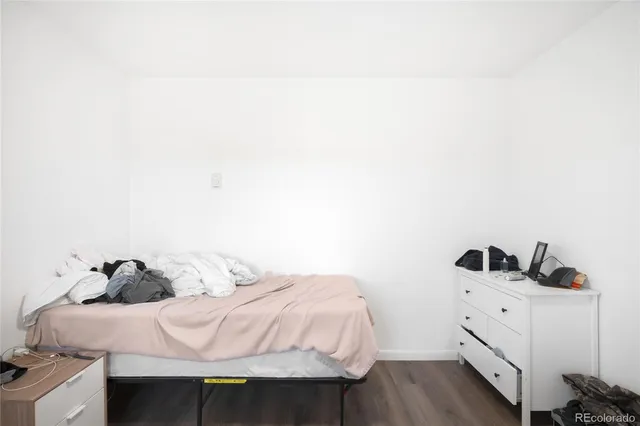 a bedroom with a bed and cabinets