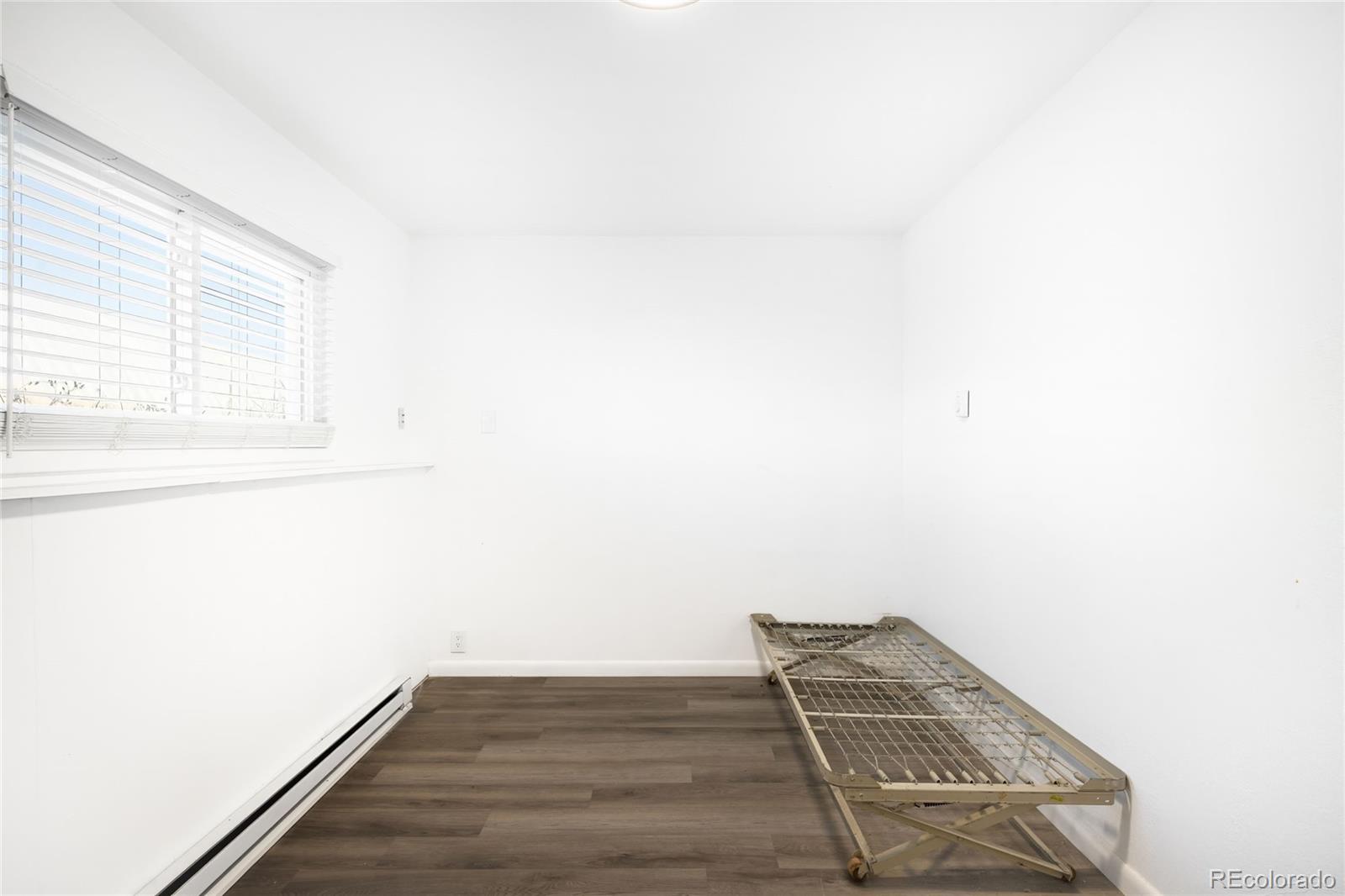 5354 Jackson Creek Road Sedalia, CO 80135 - Photo 28 of 47 a view of wooden floor in an empty room