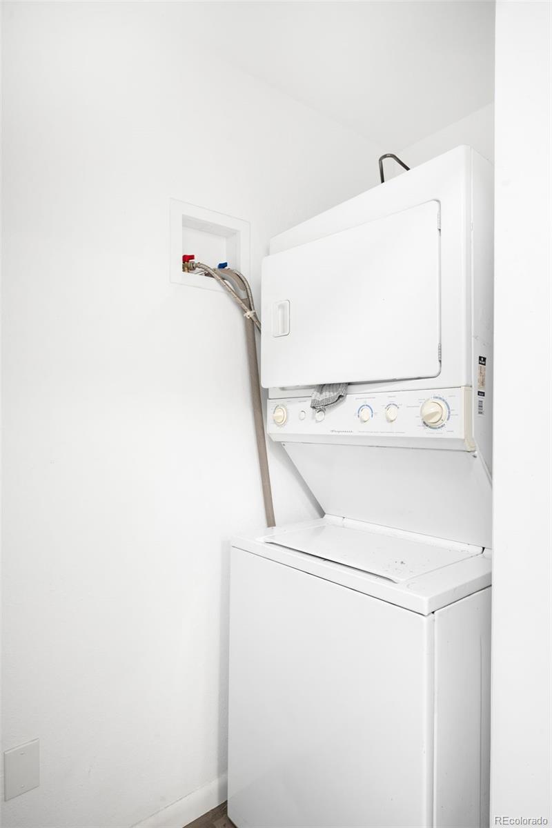 5354 Jackson Creek Road Sedalia, CO 80135 - Photo 29 of 47 a utility room with dryer and washer