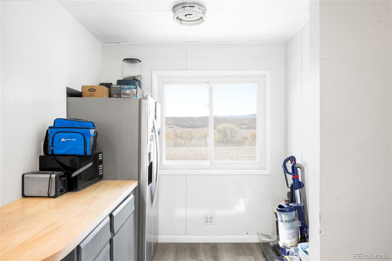 5354 Jackson Creek Road Sedalia, CO 80135 - Photo 31 of 47 a room with furniture and a window