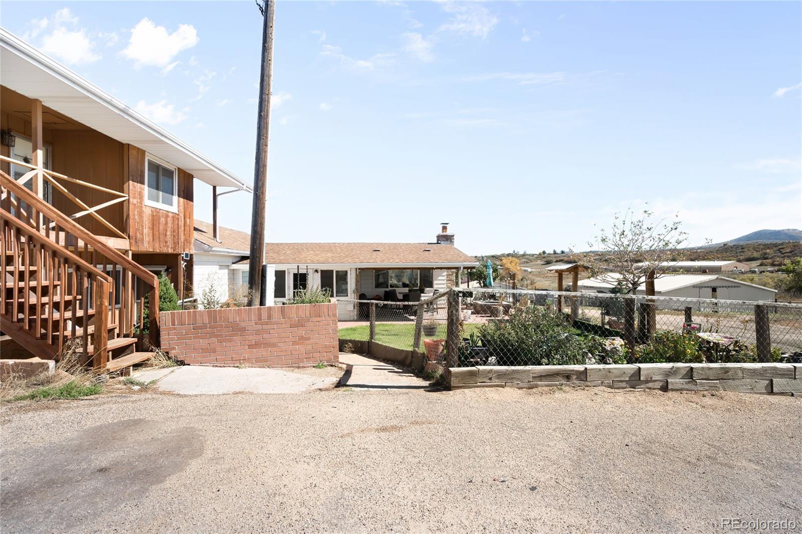 5354 Jackson Creek Road Sedalia, CO 80135 - Photo 4 of 47 a view of a terrace with a road