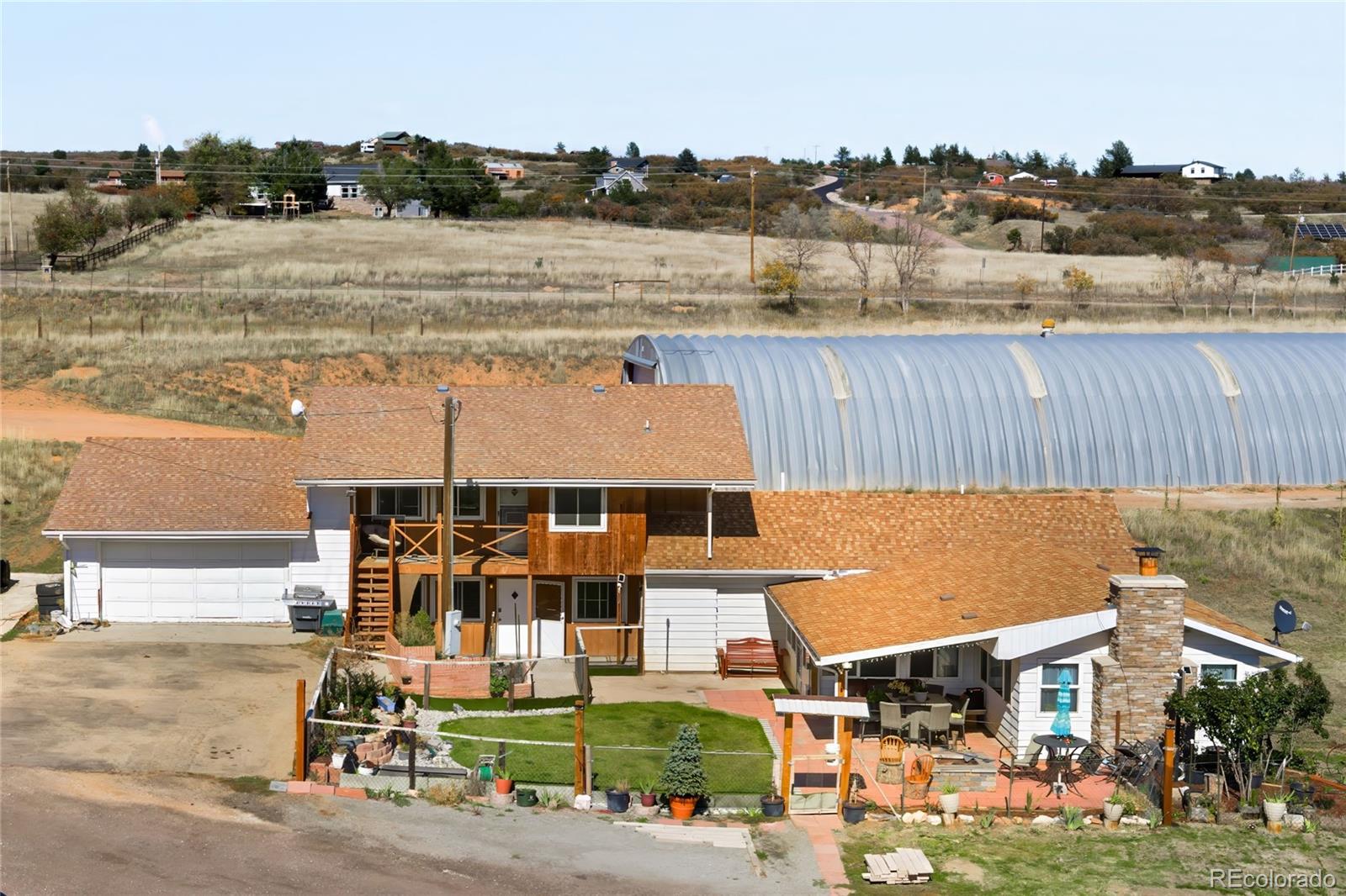 5354 Jackson Creek Road Sedalia, CO 80135 - Photo 47 of 47 a view of a lake with a yard and large trees