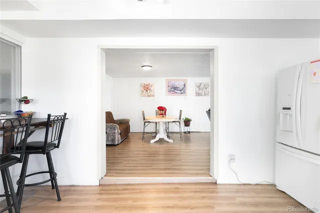 a dining room with table and chairs