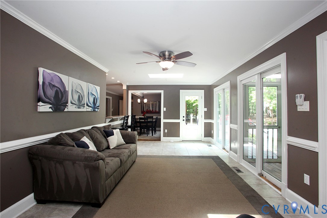 231 Hazelmere Drive Chesterfield, VA 23236 - Photo 11 of 33 a living room with furniture and a large window with balcony view