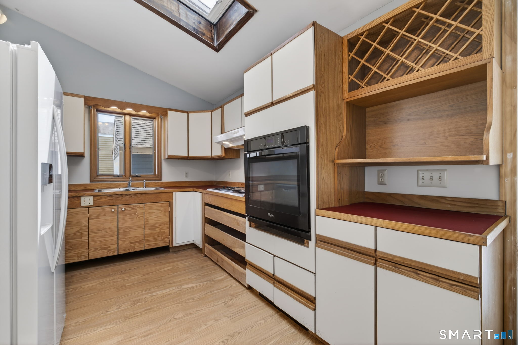 19 High Street Groton, CT 06340 - Photo 12 of 38 a kitchen with granite countertop white cabinets and white appliances