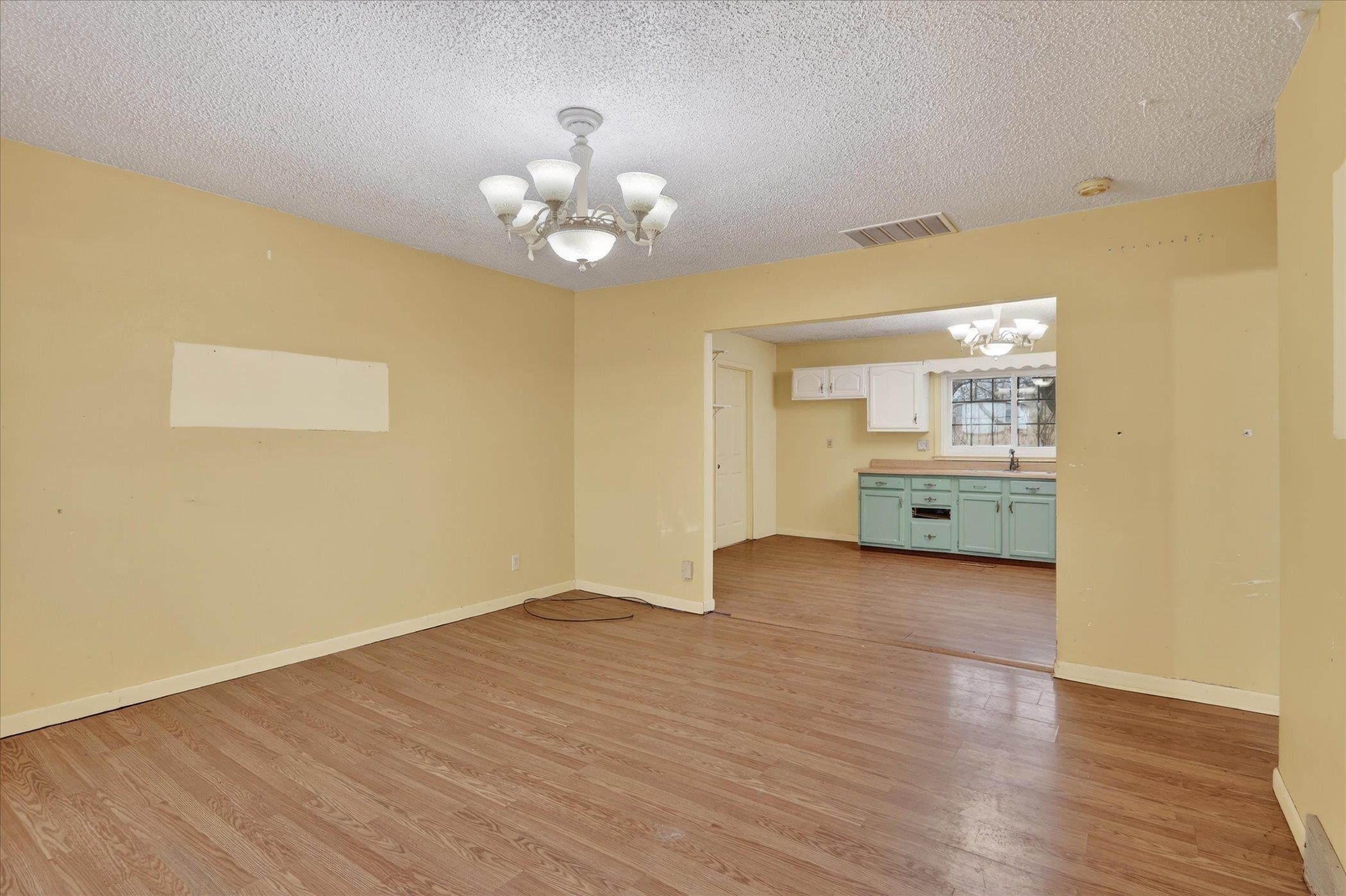 219 River Road Rochelle, IL 61068 - Photo 14 of 40 a view of livingroom and kitchen with wooden floor