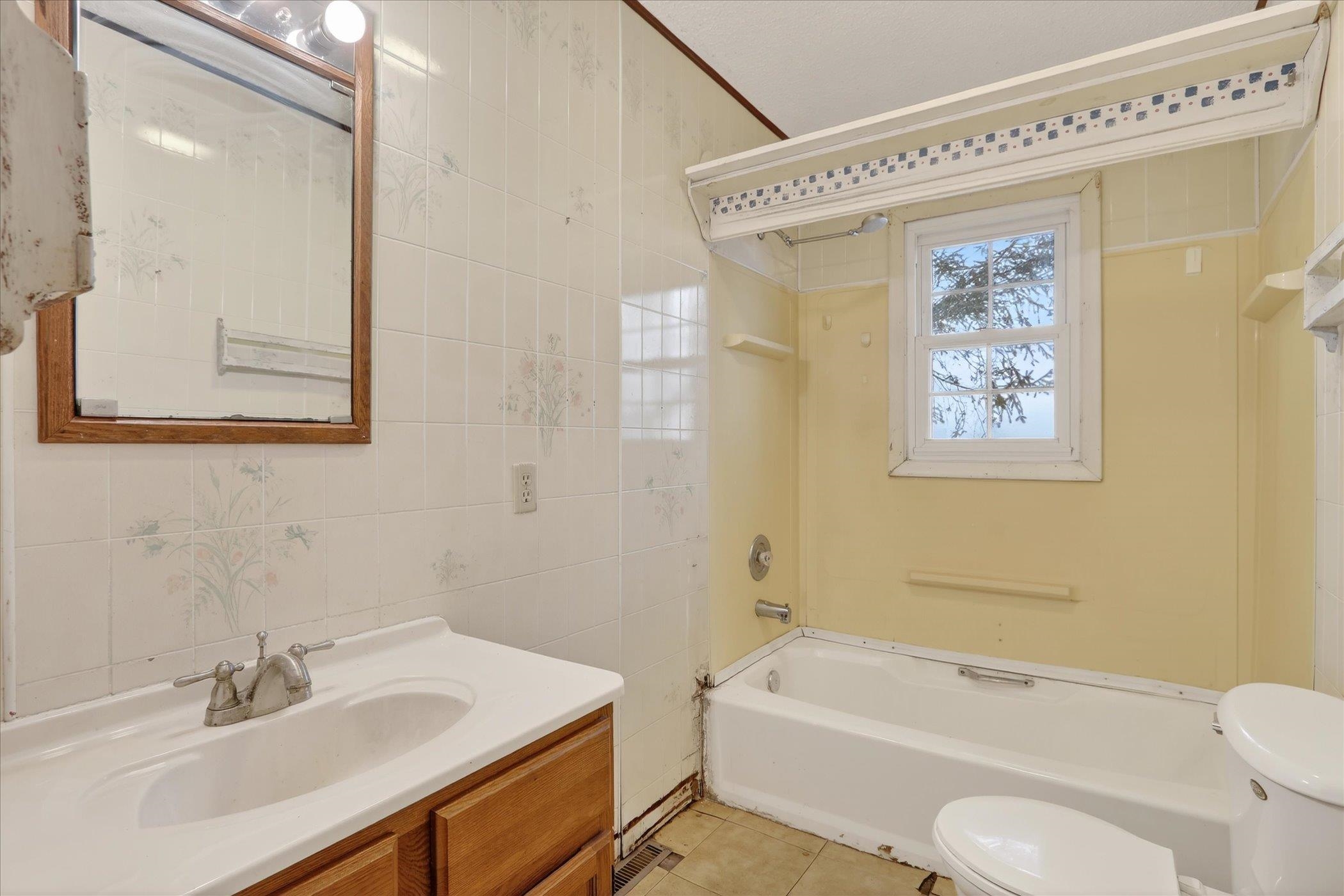 219 River Road Rochelle, IL 61068 - Photo 29 of 40 a bathroom with a sink a toilet and shower