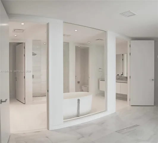 a view of a room with floor to ceiling windows