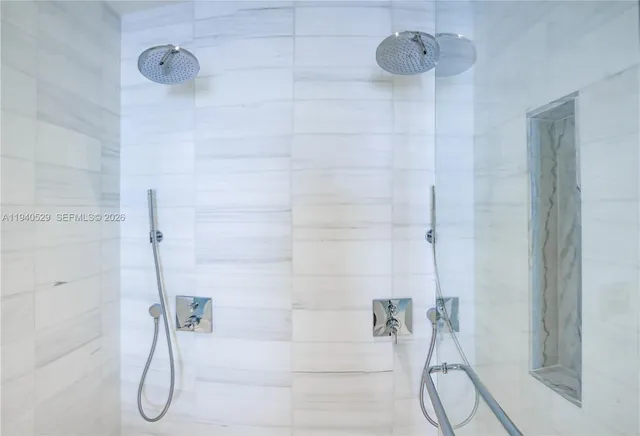 a view of a city from a glass door