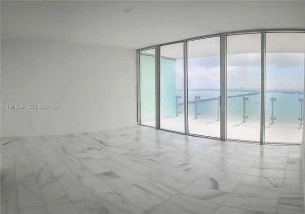 a bathroom with a shower a toilet and sink