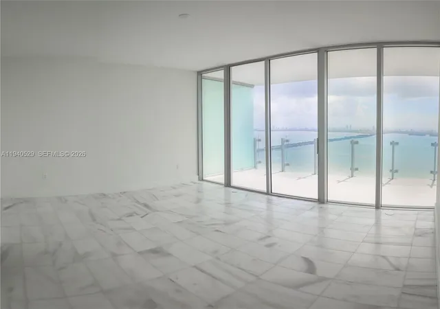 a bathroom with a shower a toilet and sink