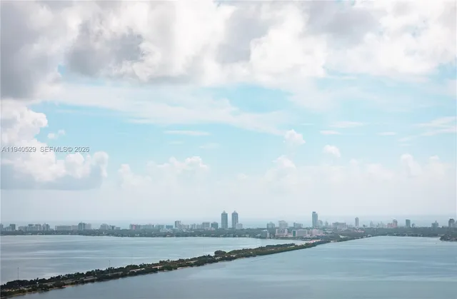 a bathroom with a sink a shower and a mirror