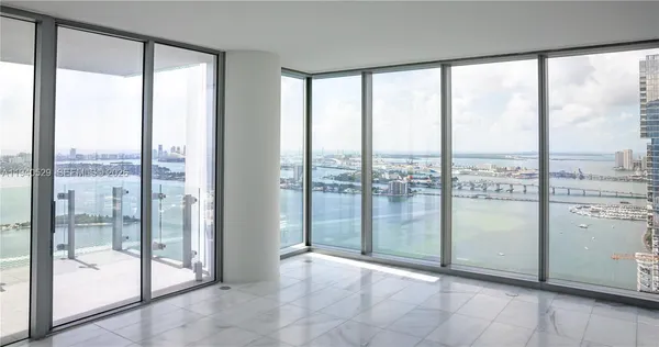 a view of a glass door and the floor to ceiling window