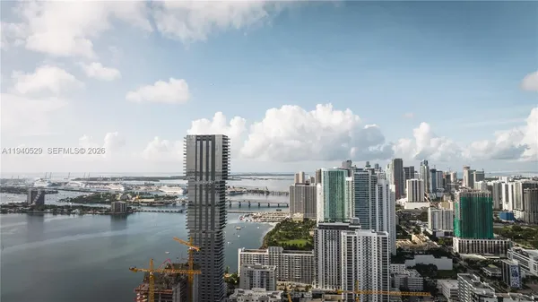 a view of a house with swimming pool and sitting area