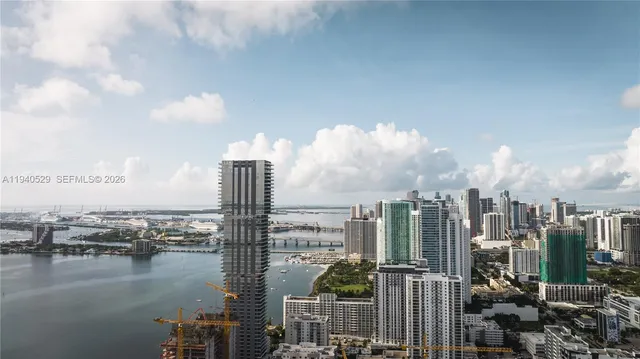 a view of a house with swimming pool and sitting area