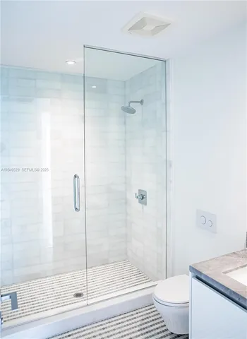 a view of a balcony with wooden floor and fence