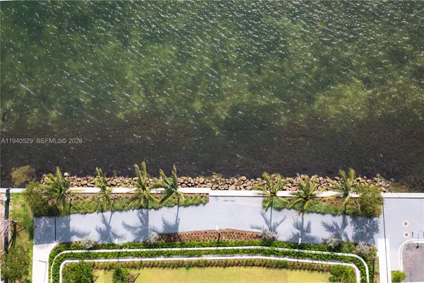 a room with furniture pool table and window