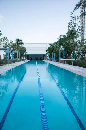 a view of roof deck with chair and wooden floor
