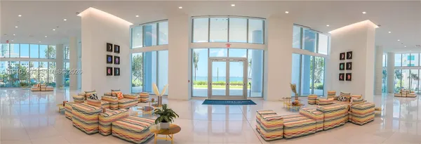 a view of a hallway with washer and dryer