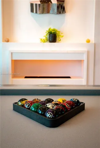 a living room with furniture and large windows