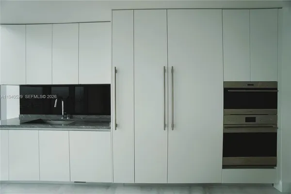 a living room with a flat screen tv and a fireplace