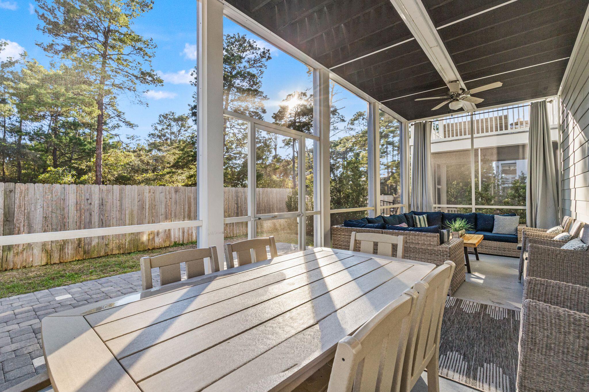 72 Magical Place Santa Rosa Beach, FL 32459 - Photo 13 of 44 a view of a patio with a table chairs and a backyard