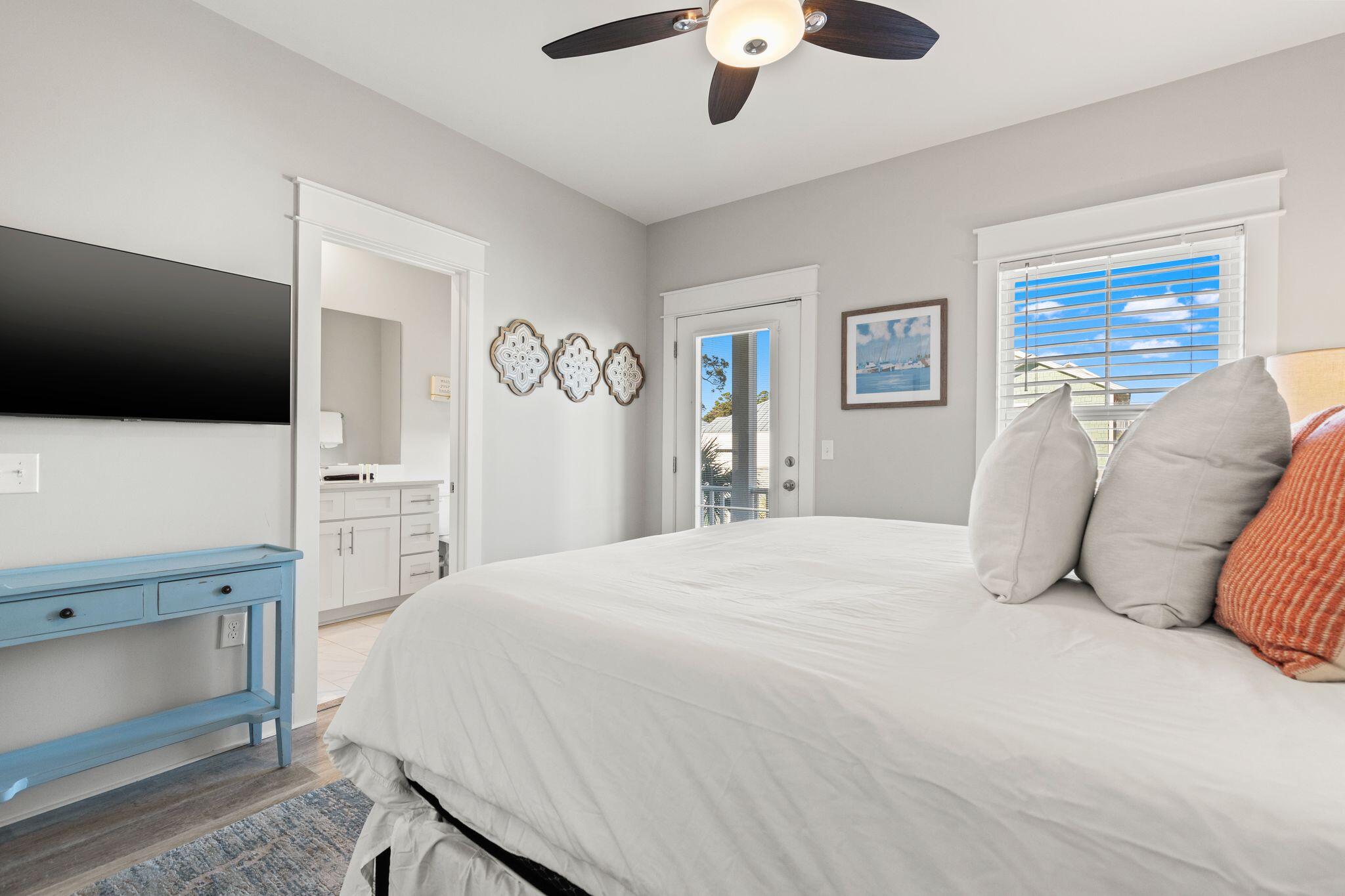 72 Magical Place Santa Rosa Beach, FL 32459 - Photo 19 of 44 a bedroom with a bed and a flat screen tv