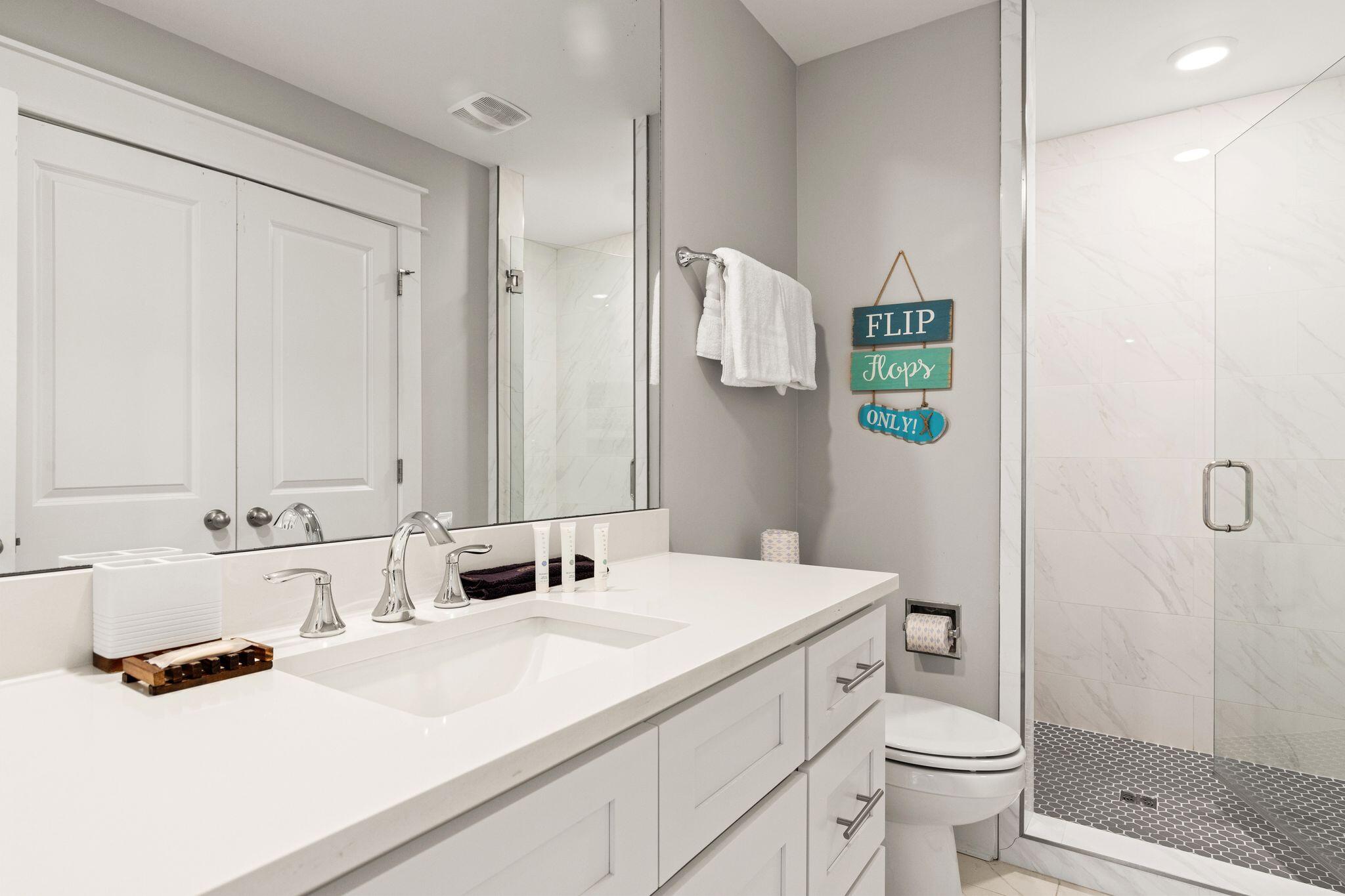 72 Magical Place Santa Rosa Beach, FL 32459 - Photo 26 of 44 a bathroom with a granite countertop sink mirror vanity and toilet