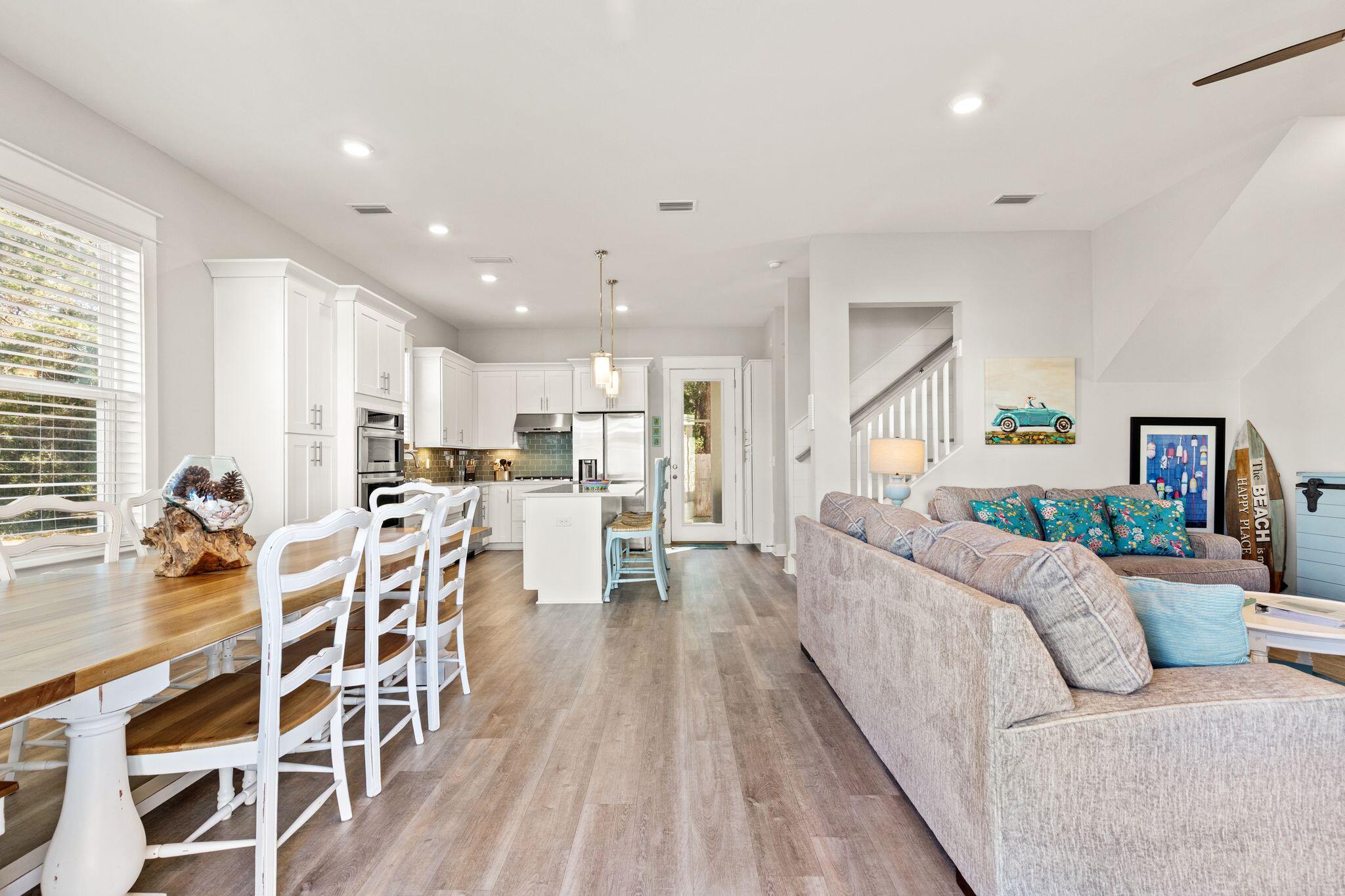 72 Magical Place Santa Rosa Beach, FL 32459 - Photo 4 of 44 a living room with furniture and a wooden floor